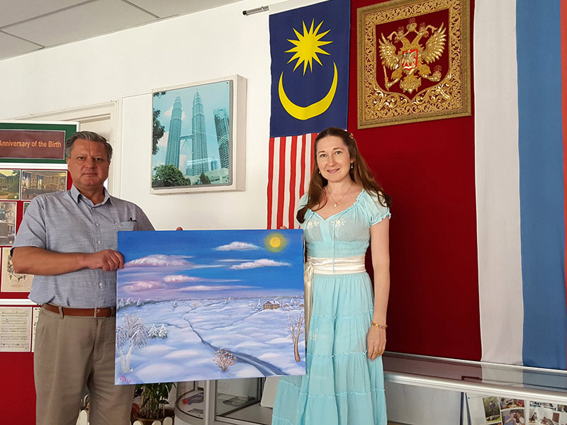 Natalya giving her paintion to Director of Russian Cultural Center Alexander Gulko, 2015